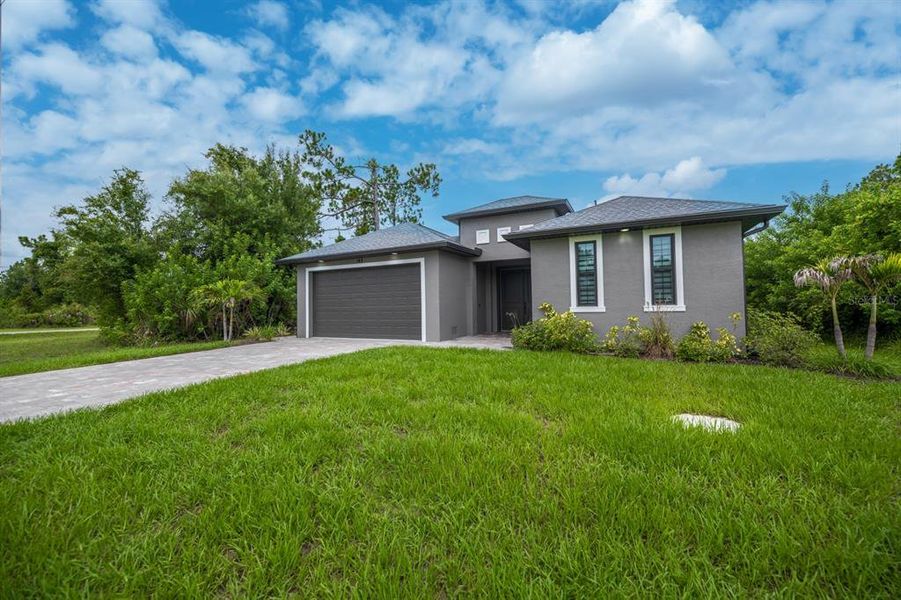 Front exterior of a new home in , Rotonda West, FL, highlighting curb appeal (Image 27). Front exterior of a new home in , Rotonda West, FL, highlighting curb appeal (Image 27).