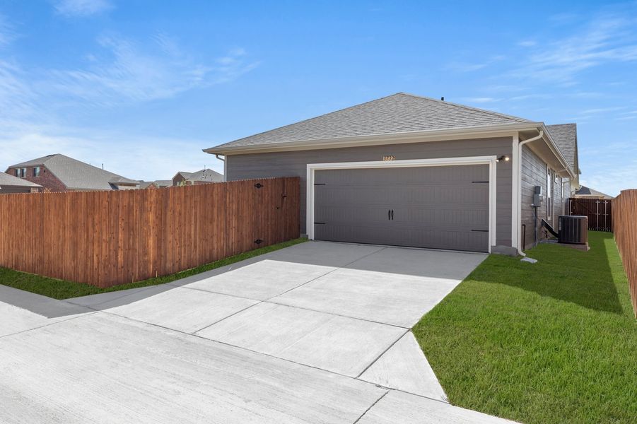 Front exterior of a new home in Heartland, Crandall, TX, highlighting curb appeal (Image 27). Front exterior of a new home in Heartland, Crandall, TX, highlighting curb appeal (Image 27).