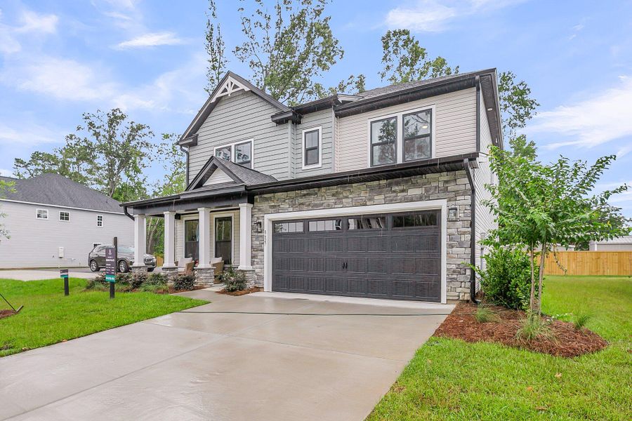 Front exterior of a new home in Indigo Place, North Charleston, SC, highlighting curb appeal (Image 19). Front exterior of a new home in Indigo Place, North Charleston, SC, highlighting curb appeal (Image 19).