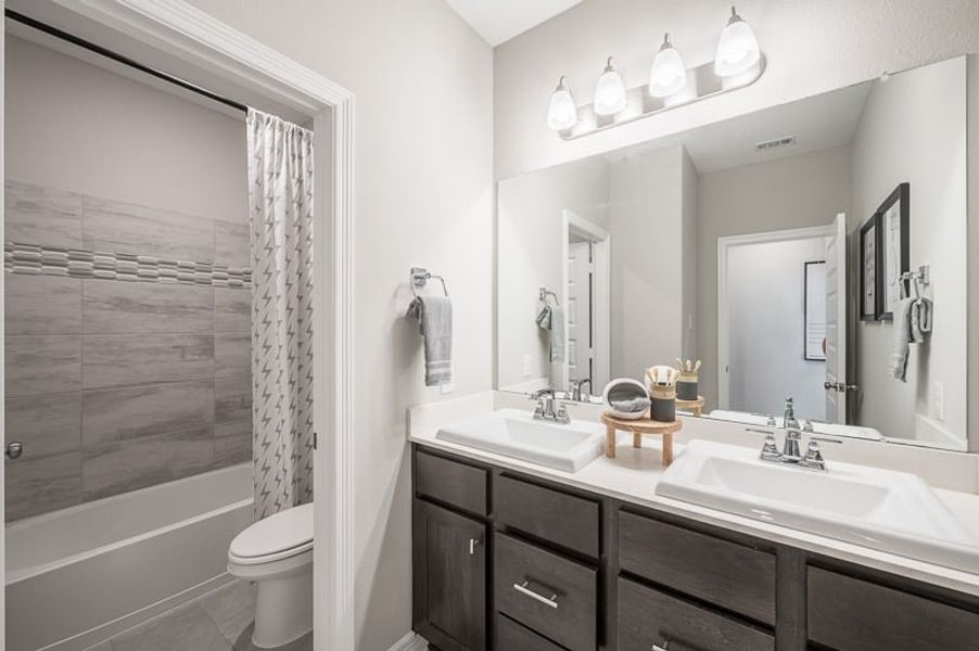 Furnished interior view inside a new home in Woodson’s Reserve 45′, Spring (Image 30).