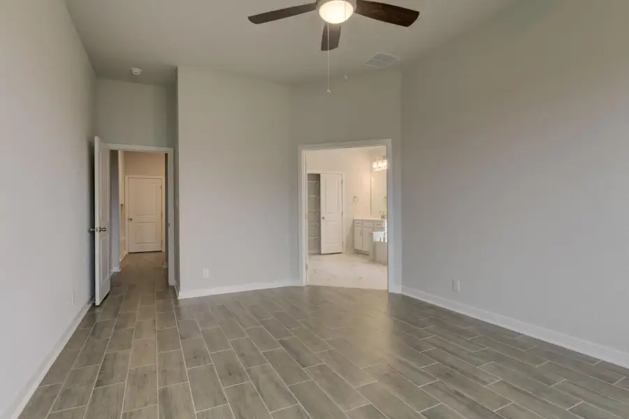 Representative unfurnished interior of a home built from the Guadalupe by Ashton Woods in Saddlebrook Ranch, Schertz (Image 25).