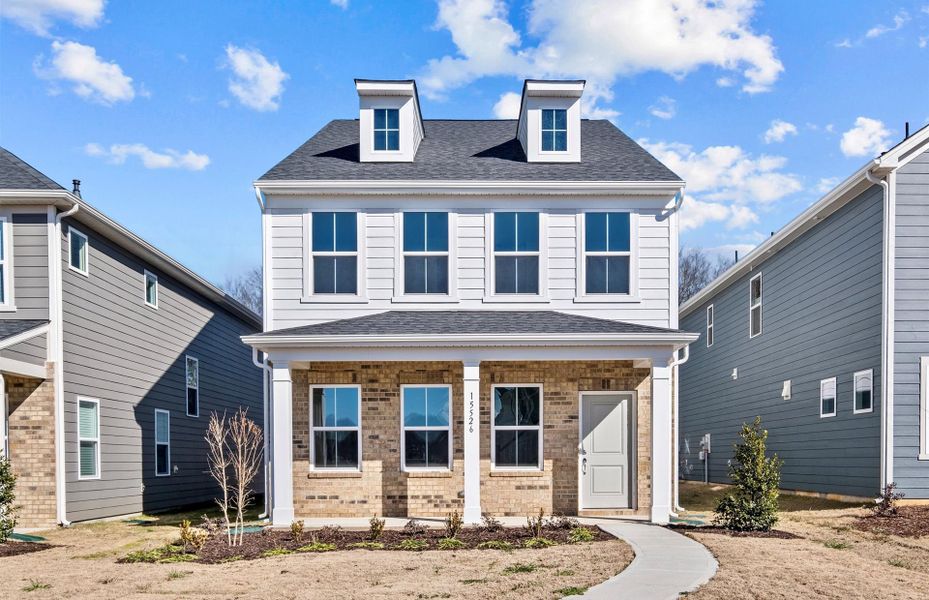 Representative exterior photo of a completed home built from the Norman by Pulte Homes in Riverstone, Monroe, NC (Image 23).