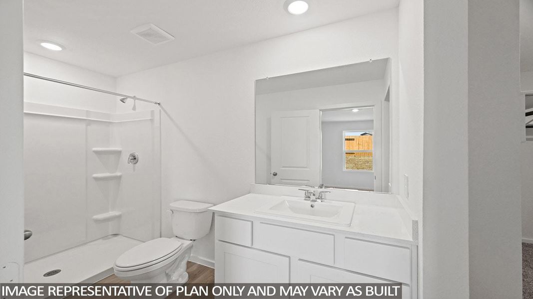Full bath featuring vanity, a shower stall, recessed lighting, and light wood finished floors
