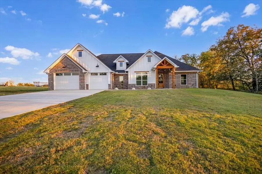 Front exterior of a new home in , Lindale, TX, highlighting curb appeal (Image 2). Front exterior of a new home in , Lindale, TX, highlighting curb appeal (Image 2).