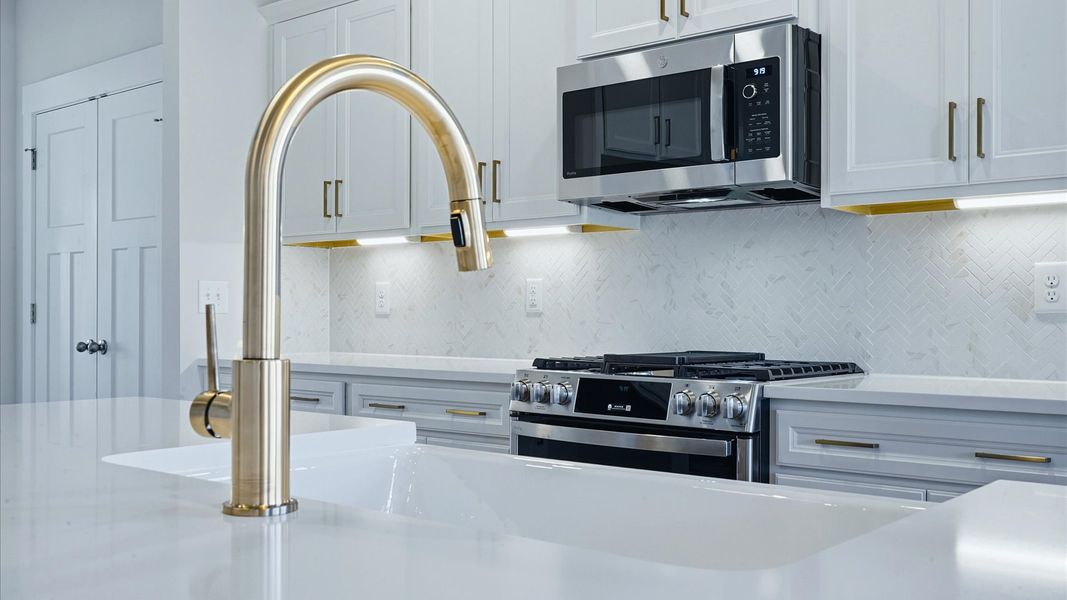 Well-designed kitchen with a center island and tasteful finishes that elevate everyday living at Mulberry Estates