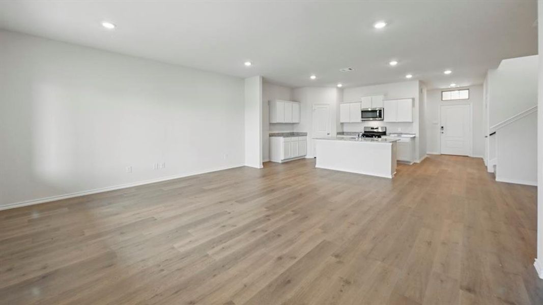 Unfurnished living room with recessed lighting and light wood-style floors