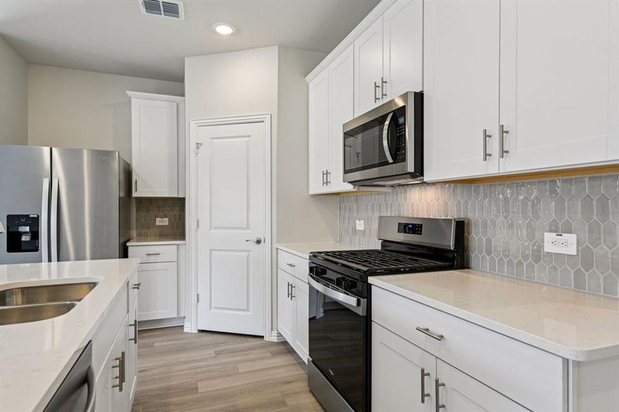 Furnished interior view inside a new home in Parks at Foster Crossing - Signature Series, Anna (Image 14).