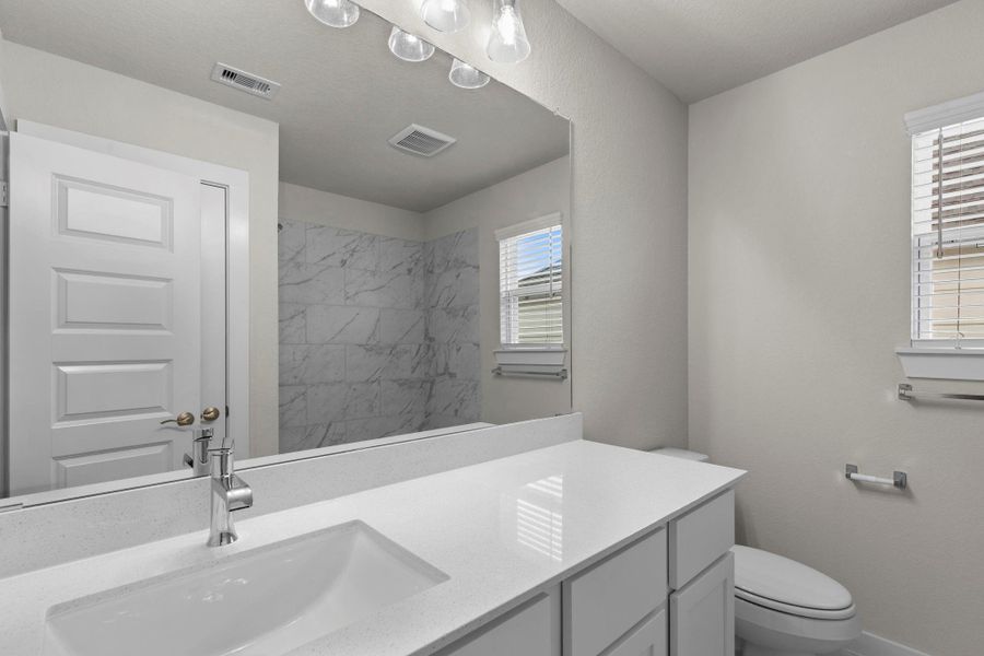 Furnished interior view inside a new home in Barton Creek Ranch, Conroe (Image 9).