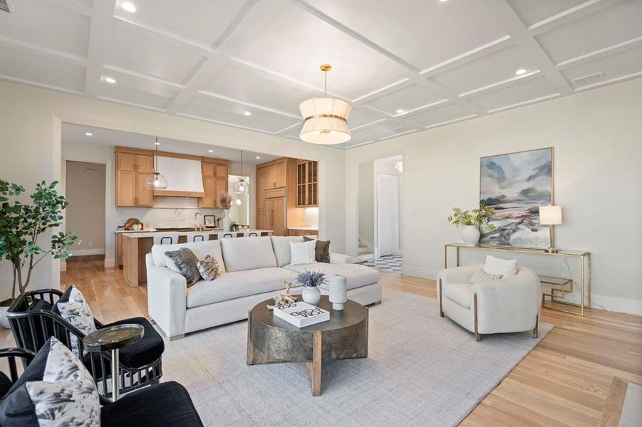 Living room with sink, light hardwood / wood-style flooring, and coffered ceiling