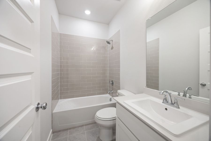 Bathroom in the Wimbledon home plan by Trophy Signature Homes – REPRESENTATIVE PHOTO