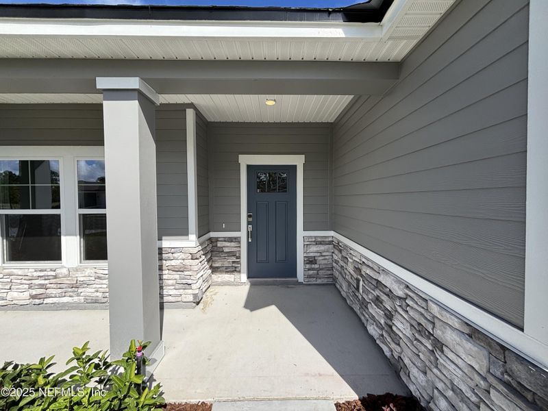 Exterior details and patio area of a home in The Magnolia Series at Reserve East, Flagler Beach (Image 3).