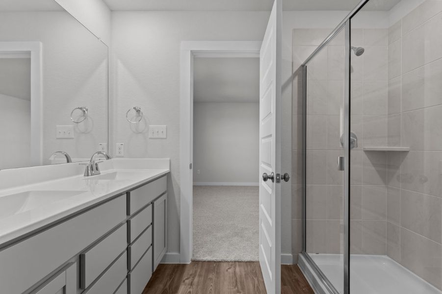 A bathroom with a glass shower.
