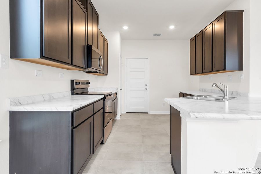 Furnished interior view inside a new home in Medina Crossing - Villa Collection, Von Ormy (Image 4).
