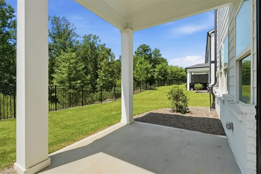 Exterior details and patio area of a home in Brooks at Riverview Landing, Smyrna (Image 24).