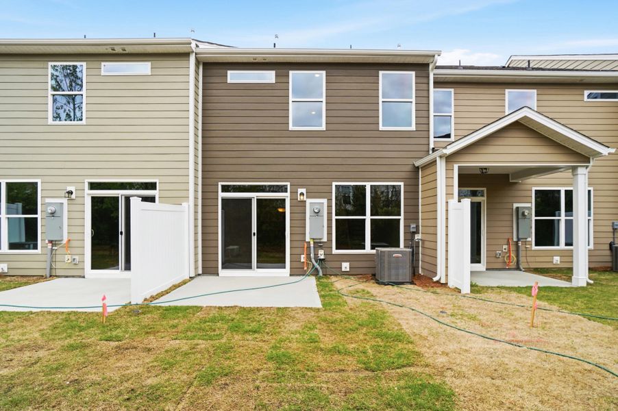 Exterior details and patio area of a home in Harrisburg Village Townhomes, Harrisburg (Image 24).