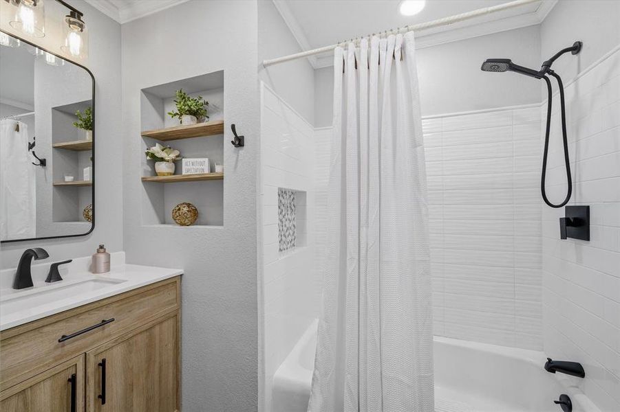 Guest bathroom with a white countertop, an undermount sink, and matte black fixtures