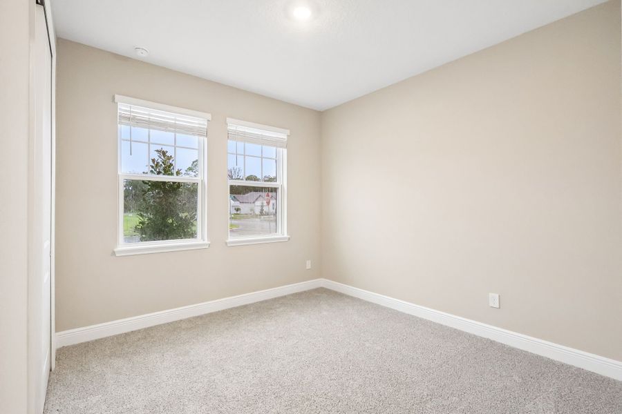 Spacious, unfurnished interior of a new home in Legends Preserve - Signature Series, Daytona Beach (Image 16).