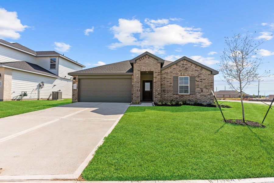 Front exterior of a new home in Evergreen, Rosenberg, TX, highlighting curb appeal (Image 24).