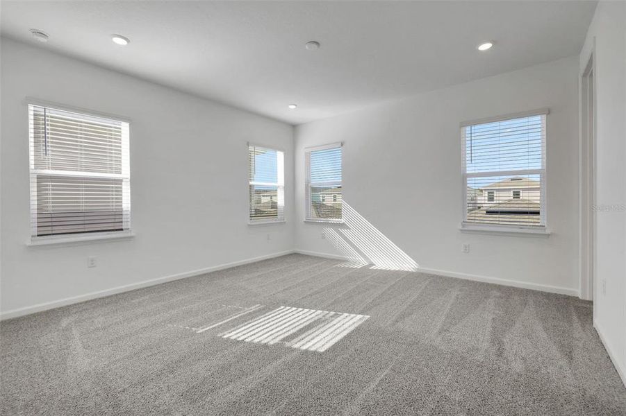 Spacious, unfurnished interior of a new home in Serenade at Ovation, Winter Garden (Image 27).