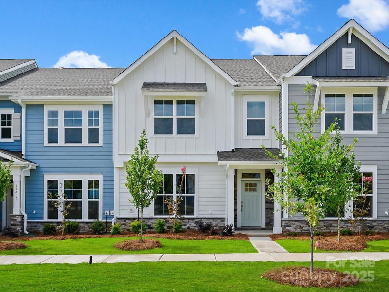 Front exterior of a new home in North Creek Village - Townhomes, Huntersville, NC, highlighting curb appeal (Image 19). Front exterior of a new home in North Creek Village - Townhomes, Huntersville, NC, highlighting curb appeal (Image 19).