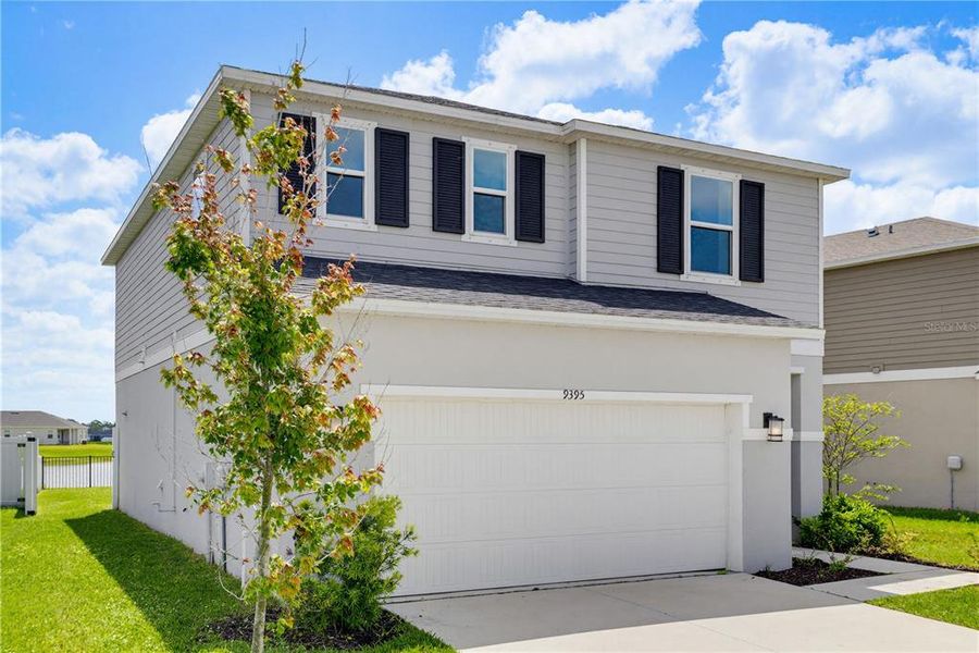 Front exterior of a new home in , Parrish, FL, highlighting curb appeal (Image 28).
