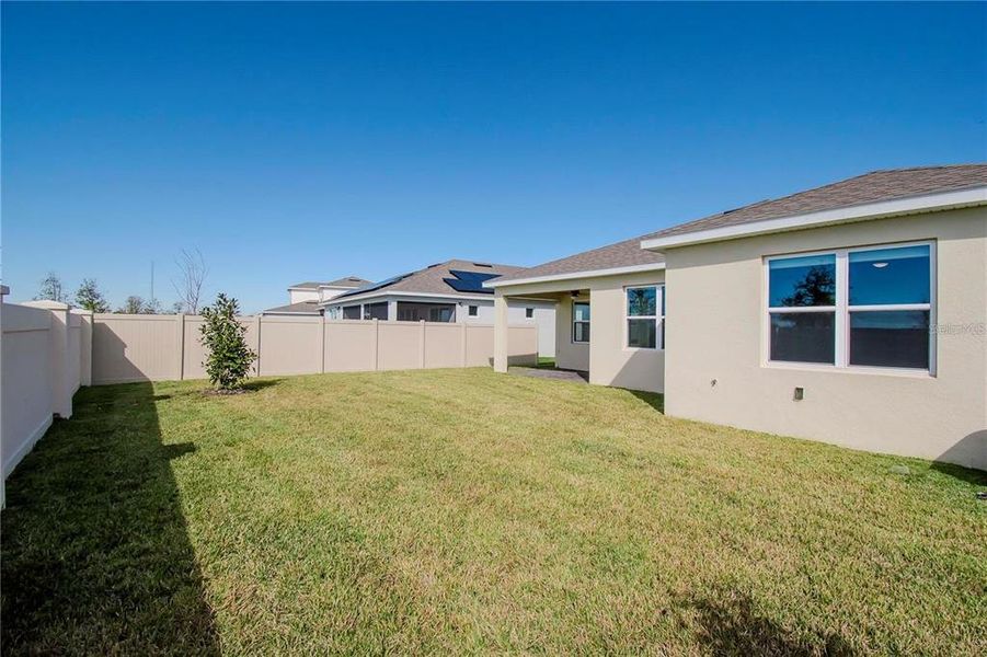 Exterior details and patio area of a home in Tohoqua Reserve, Kissimmee (Image 25).