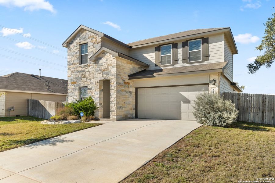 Front exterior of a new home in Brookstone Creek, San Antonio, TX, highlighting curb appeal (Image 1).
