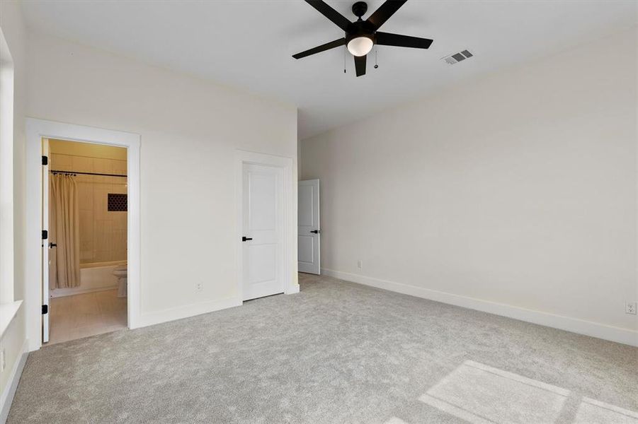 Unfurnished bedroom featuring carpet, baseboards, and ensuite bath Unfurnished bedroom featuring carpet, baseboards, and ensuite bath