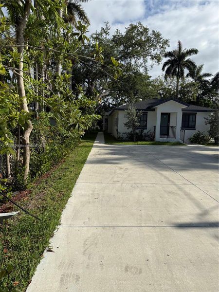 Front exterior of a new home in , Florida City, FL, highlighting curb appeal (Image 13).