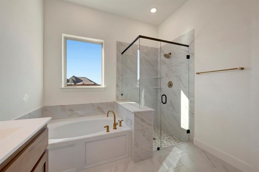 Bathroom with vanity, a marble finish shower, a bath, recessed lighting, and light marble finish flooring Bathroom with vanity, a marble finish shower, a bath, recessed lighting, and light marble finish flooring