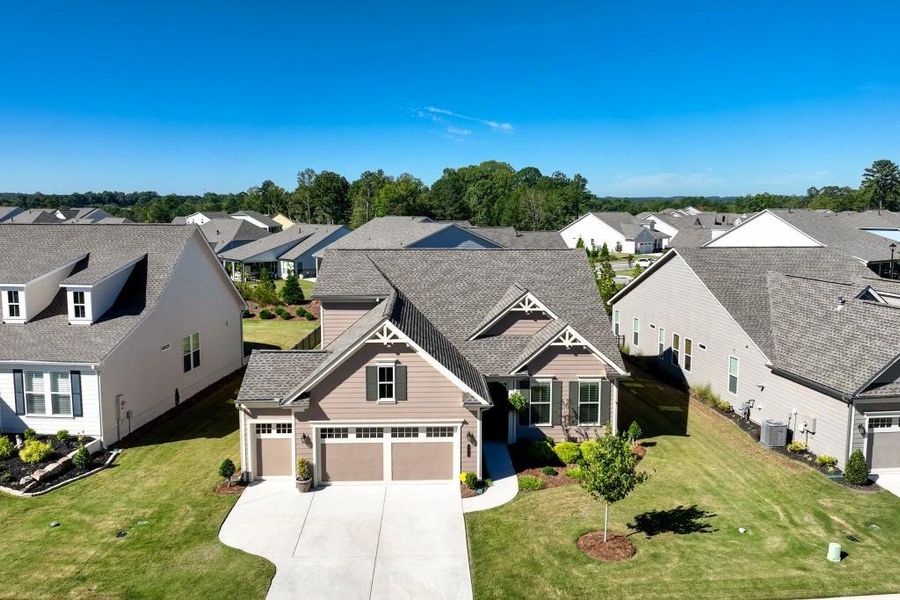 Front exterior of a new home in , Hoschton, GA, highlighting curb appeal (Image 26).