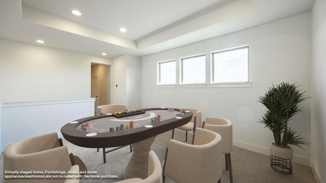 Recreation room with a raised ceiling, carpet floors, and recessed lighting Recreation room with a raised ceiling, carpet floors, and recessed lighting