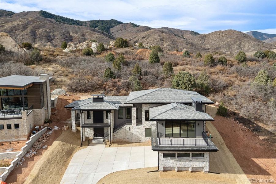 Front exterior of a new home in , Littleton, CO, highlighting curb appeal (Image 1).