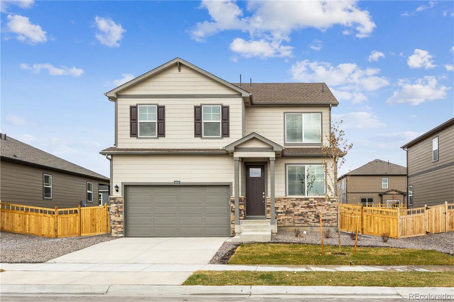 Front exterior of a new home in Ridge at Johnstown, Johnstown, CO, highlighting curb appeal (Image 2).