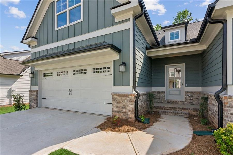 Front exterior of a new home in Traditions of Braselton, Jefferson, GA, highlighting curb appeal (Image 15).