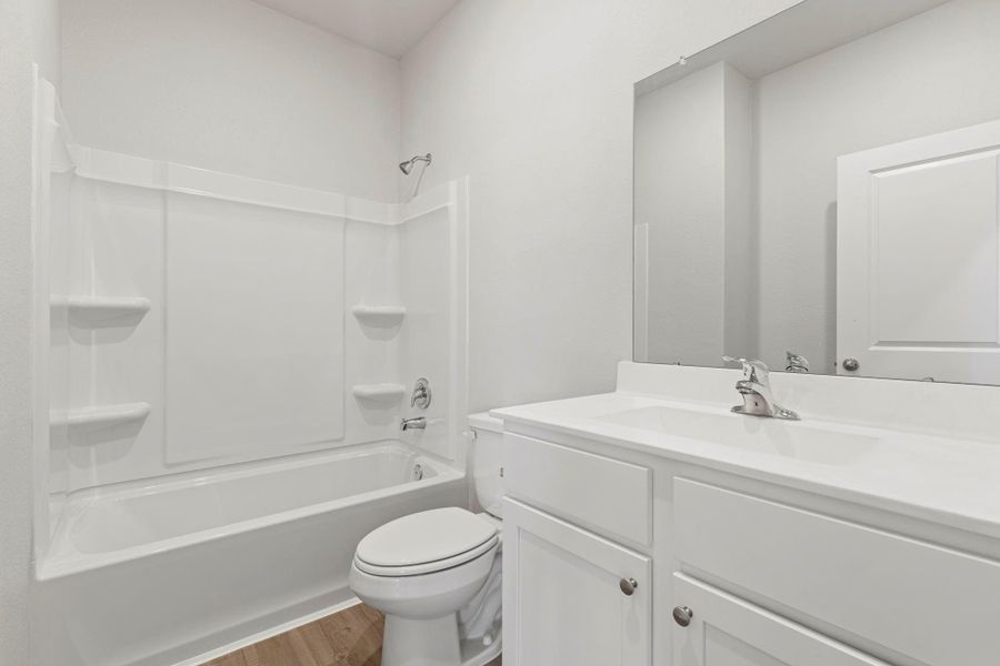 Furnished interior view inside a new home in Canterra Creek, Iowa Colony (Image 5).