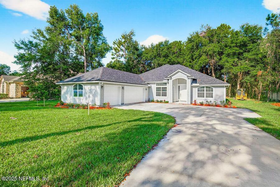 Front exterior of a new home in , Jacksonville, FL, highlighting curb appeal (Image 26). Front exterior of a new home in , Jacksonville, FL, highlighting curb appeal (Image 26).