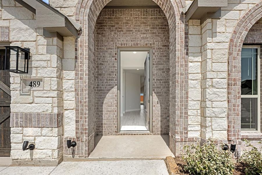 Front exterior of a new home in The Retreat at North Grove 60, Waxahachie, TX, highlighting curb appeal (Image 24).