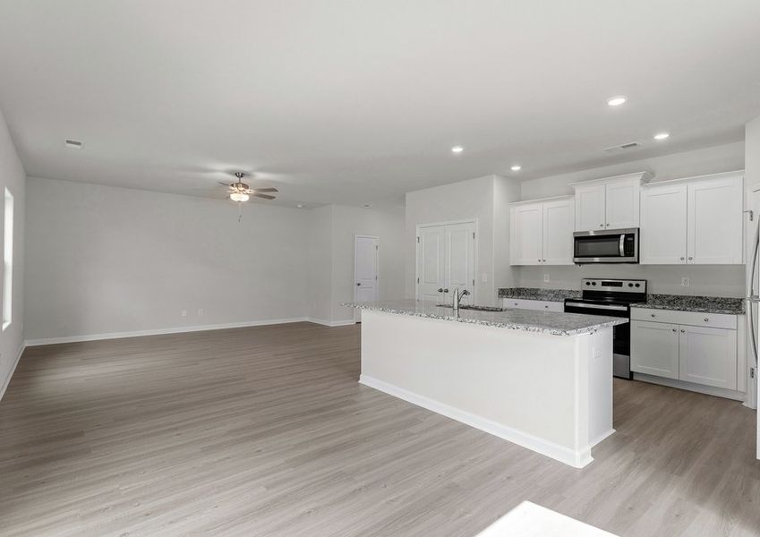 The kitchen opens up to the living room and dining room.