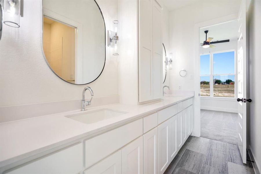 Bathroom featuring vanity and ceiling fan