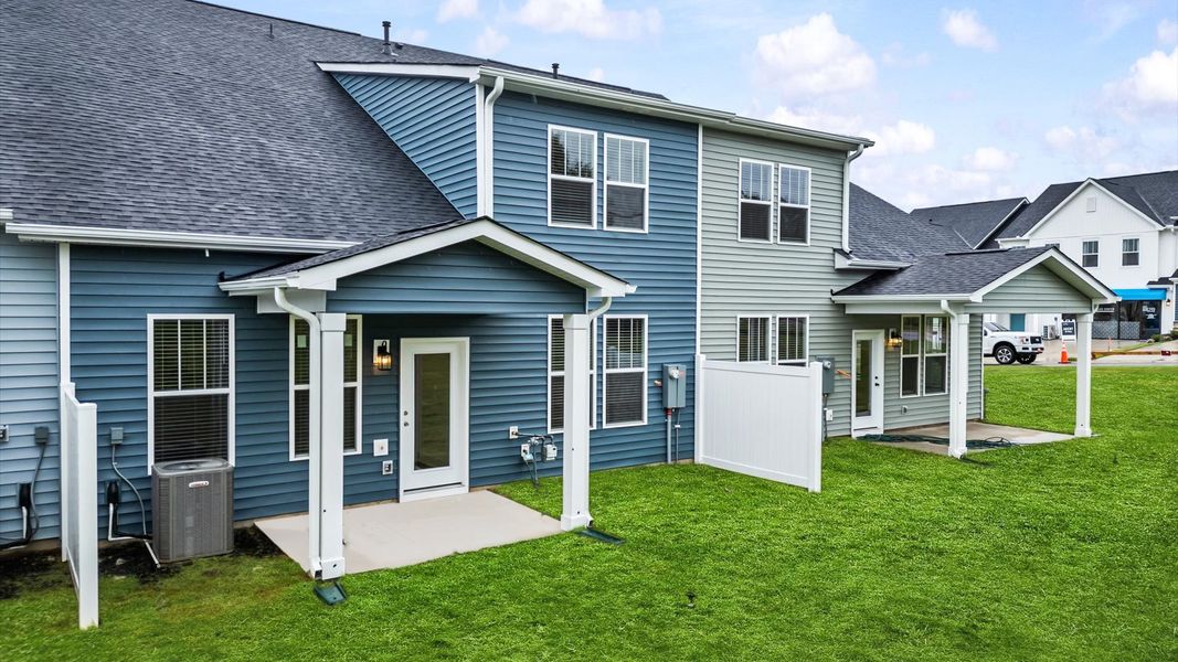 Rear covered porch creates a seamless extension of this home’s elegant design at Silo Ridge by DRB Homes in Anderson, SC