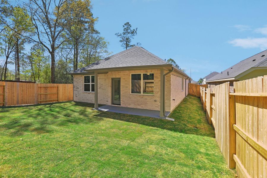 Exterior details and patio area of a home in Woodhavyn 40', Magnolia (Image 20).