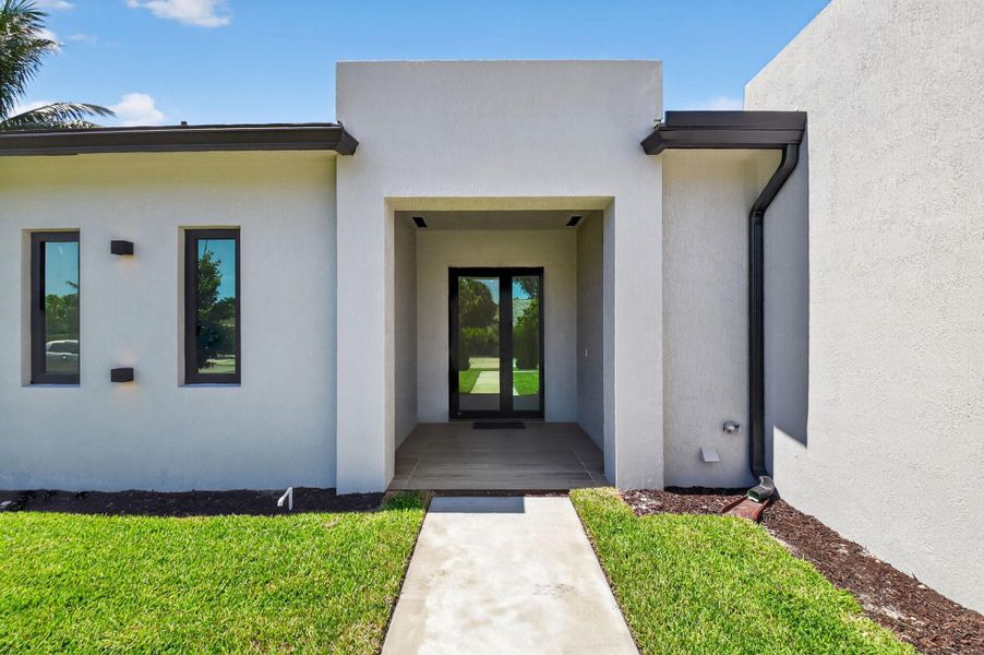 Front exterior of a new home in , Palm Springs, FL, highlighting curb appeal (Image 27).