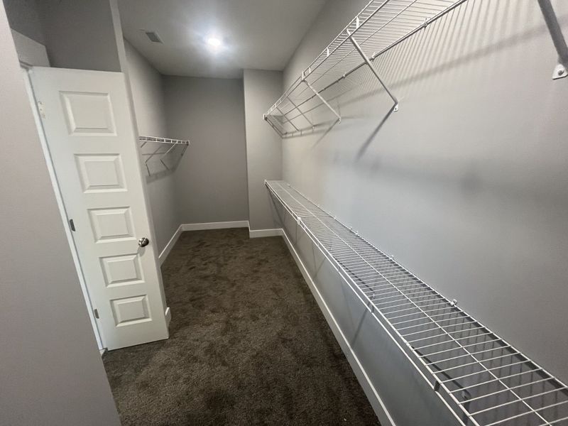 primary bedroom's massive walk in closet primary bedroom's massive walk in closet