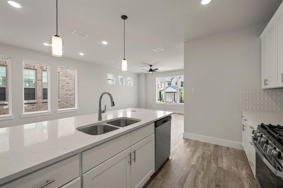 The chef will never be left out of the party in this wonderful open concept design home. The chef will never be left out of the party in this wonderful open concept design home.