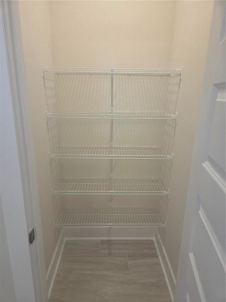 Large linen closet inside of the primary bathroom. Large linen closet inside of the primary bathroom.