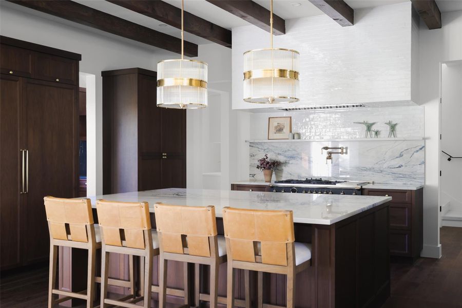 The social hub of the home. This massive quartzite center island isn't just for prep; it’s designed with a deep overhang to serve as a natural breakfast bar and gathering spot. It offers a clear view across the entire main level, making it the perfect place for a casual morning coffee or a quick weeknight meal.