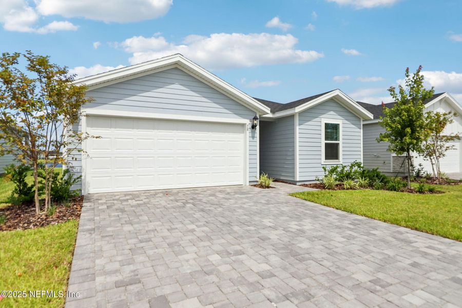 Front exterior of a new home in Colbert Landings, Palm Coast, FL, highlighting curb appeal (Image 20).