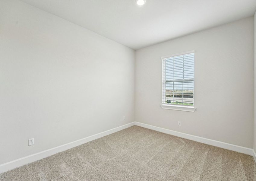 Carpeted secondary bedroom featuring a window with natural light. Carpeted secondary bedroom featuring a window with natural light.