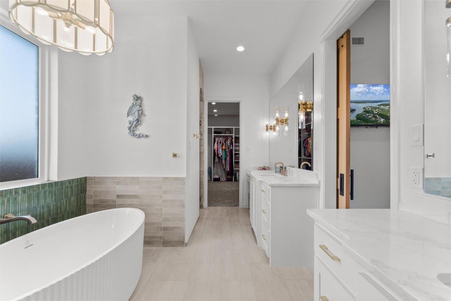 free standing tub/walk-in shower, separate vanities and custom contrasting tile in tub surround and shower. free standing tub/walk-in shower, separate vanities and custom contrasting tile in tub surround and shower.